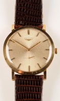 Lot 715 - A 9ct. gold Longines wristwatch, the silver...