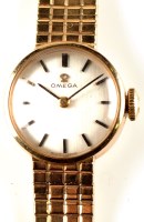 Lot 716 - A lady's 9ct. gold Omega cocktail watch, with...