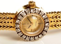 Lot 722 - A lady's Omega 18ct. gold cocktail watch, the...