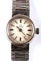 Lot 726 - A lady's 9ct. white gold cased Omega cocktail...