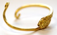 Lot 731 - A high carat yellow gold bangle, the top with...