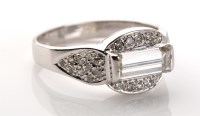 Lot 746 - A diamond ring, the central baguette cut...