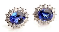 Lot 757 - A pair of tanzanite and diamond cluster...