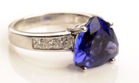 Lot 758 - A tanzanite and diamond ring, the central...