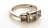 Lot 762 - A three stone diamond ring, the central stone...