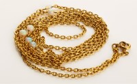 Lot 766 - A yellow metal cable link chain with six opal...