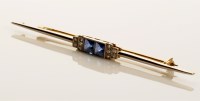 Lot 768 - An Art Deco sapphire and diamond bar brooch,...
