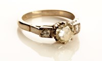 Lot 778 - A diamond ring, the central brilliant cut...