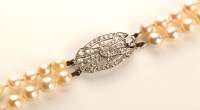 Lot 782 - A double row cultured pearl necklace, strung...