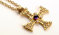 Lot 786 - A modern cross pendant set central cabochon...