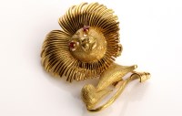 Lot 804 - A French 18ct. yellow gold lion pattern brooch,...