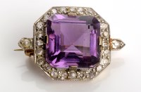 Lot 809 - An Art Deco amethyst and diamond brooch, the...