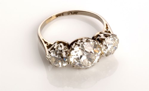 Lot 810 - A three stone diamond ring, all brilliant cut,...