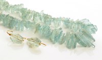 Lot 816 - An aquamarine necklace, made up of a single...