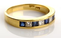 Lot 824 - A sapphire and diamond ring, pave set with...