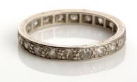 Lot 826 - A diamond eternity ring, set throughout with...