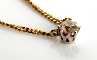 Lot 828 - A single stone diamond drop pendant, the old...