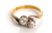 Lot 832 - A two stone diamond ring, each diamond...