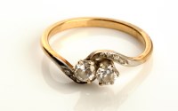 Lot 833 - A two-stone diamond ring, each stone weight...