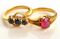 Lot 834 - A three stone sapphire ring, claw set in...