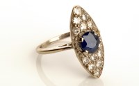 Lot 835 - A sapphire and diamond cluster ring, the...