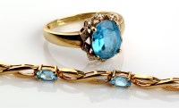 Lot 840 - A blue topaz and diamond cluster ring, the...