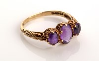 Lot 841 - A 19th Century style three stone amethyst ring,...