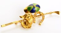 Lot 855 - An 18ct. yellow gold diamond and enamel...