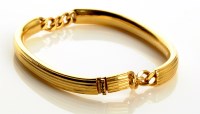 Lot 868 - An 18ct. gold Italian bracelet, made up of two...