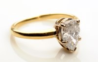 Lot 869 - A single stone diamond ring, the pear-shaped...