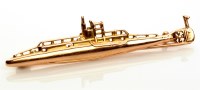 Lot 885 - A 9ct. yellow gold submarine pattern brooch,...