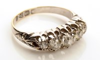 Lot 889 - A five stone diamond ring, the graduating row...