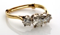 Lot 893 - A three stone diamond ring, the three...