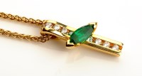 Lot 903 - An emerald and diamond pendant, the marquise...