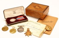 Lot 1079 - A group of military interest items, to include:...