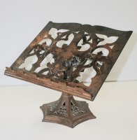 Lot 1173 - A Victorian Gothic revival copper book rest,...