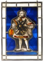 Lot 1186 - A stained glass window panel, the central...