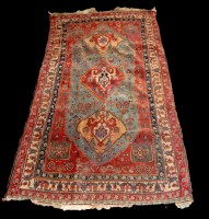 Lot 1190 - A Central Persian rug with triple medallion...