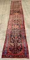 Lot 1197 - A mid 20th Century Persian Hamadan runner,...