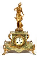 Lot 1204 - A late 19th Century gilt metal and onyx mantel...