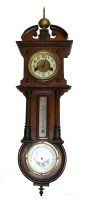 Lot 1206 - A small German wall clock, the walnut case...