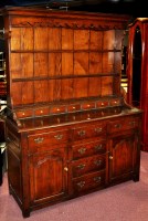 Lot 1232 - An 18th Century style oak dresser, with raised...