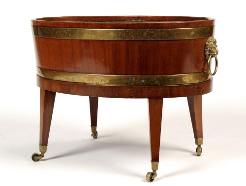 Lot 1250 - A George III mahogany oval-shaped brass-bound...