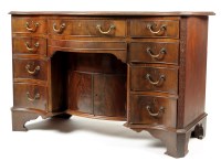 Lot 1265 - A George III style mahogany serpentine front...