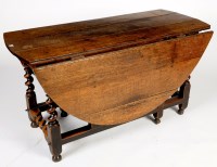 Lot 1293 - An early 18th Century oak drop leaf table,...