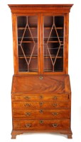 Lot 1300 - A fine quality mahogany bureau bookcase, the...