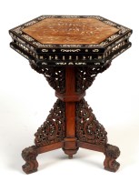 Lot 1306 - An Oriental carved hardwood hexagonal...