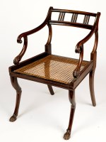 Lot 1307 - A beech open armchair, with curved bustle back...