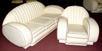 Lot 1312 - An Art Deco three piece cream leather suite,...