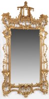 Lot 1322 - A gilt frame rococo design wall mirror with...